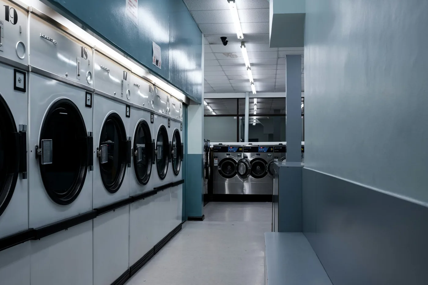 Commercial laundry equipment in an operating facility